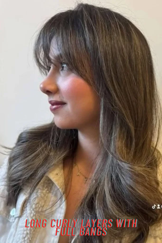 Long Curly Layers with Full Bangs